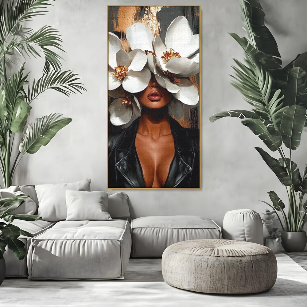 Tablou canvas cu tablou canvas cu femeie si magnolii, in rama de aluminiu auriu, pe perete intr-un living